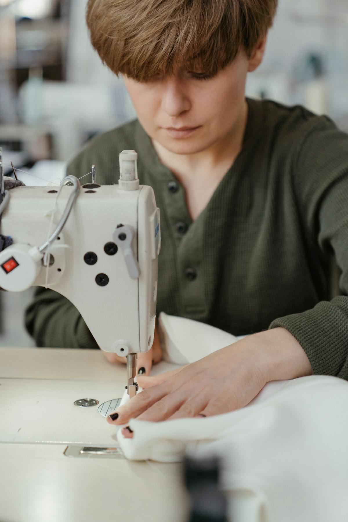 Tailor at an industrial sewing machine